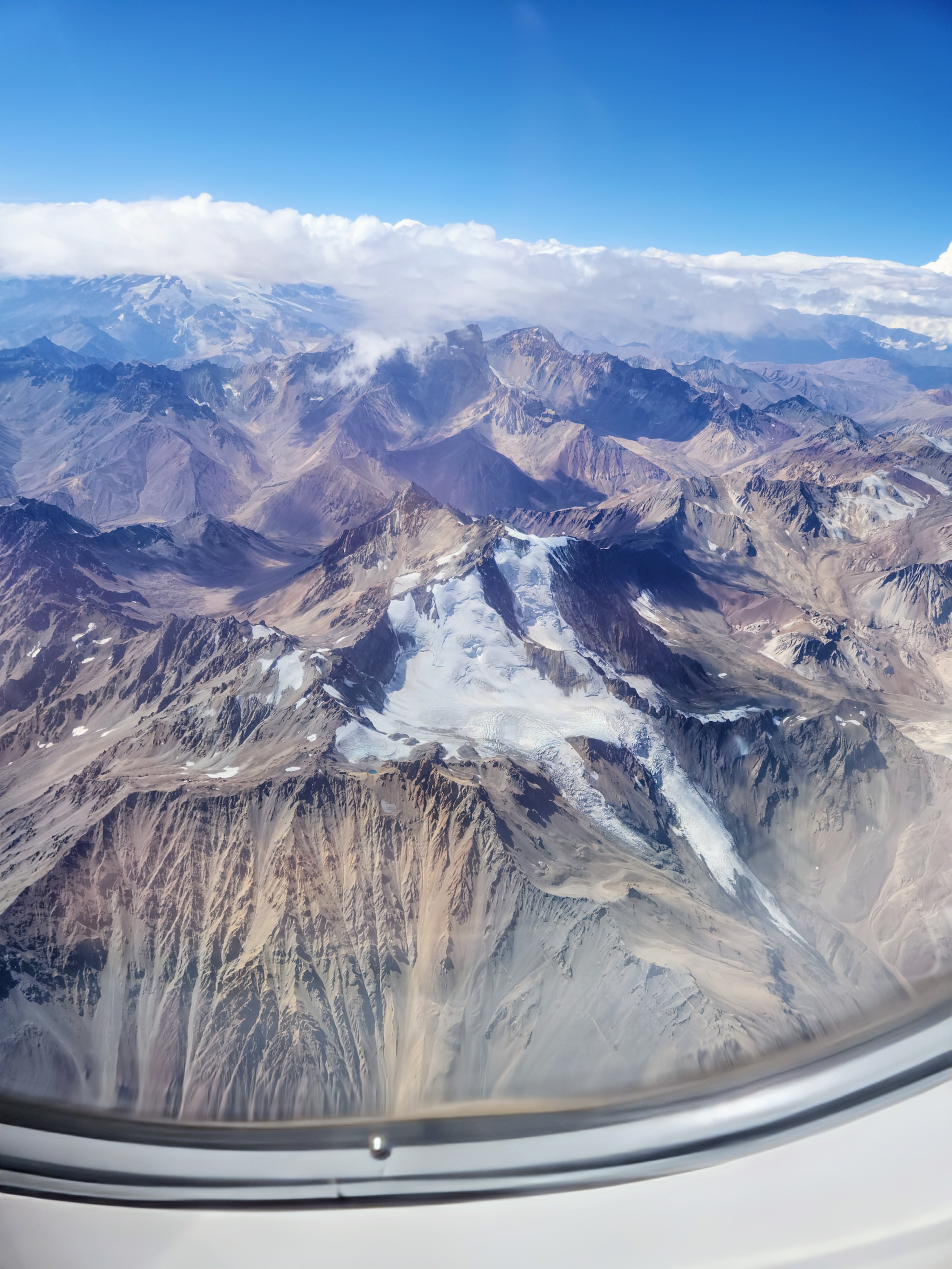 Airplane view while flying over the Andes mountains